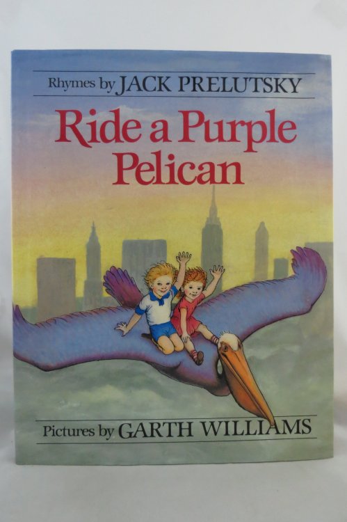 RIDE A PURPLE PELICAN; (DJ protected by a brand new, clear, acid-free mylar cover) (Signed by Author)