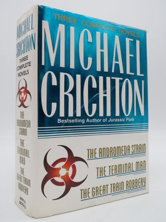 THREE COMPLETE NOVELS; The Andromeda Strain, the Terminal Man, and the Great Train Robbery (DJ Protected by a Brand New, Clear, Acid-Free Mylar Cover)