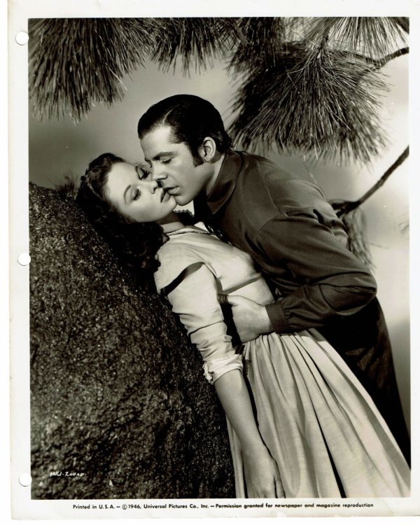 Image for A VINTAGE PUBLICITY PHOTOGRAPH of Hollywood Movie Stars SUSAN HAYWARD and DANA ANDREWS in a romantic scene from Universal Studios' A VINTAGE PUBLICITY PHOTOGRAPH of Hollywood Movie Stars SUSAN HAYWARD and DANA ANDREWS in a romantic scene from Universal Studios'