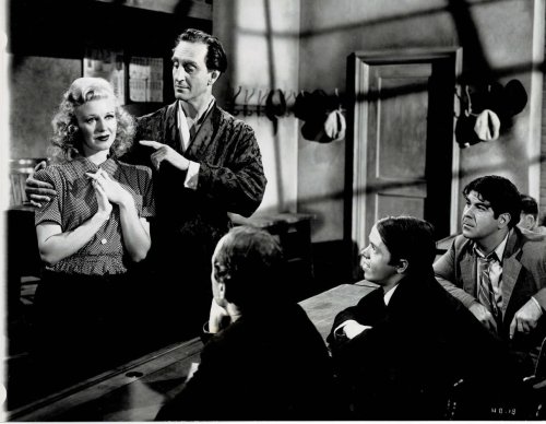 Image for A VINTAGE CONTINUITY LAYOUT PHOTOGRAPH depicting BASIL RATHBONE instructing GINGER ROGERS at his school for pickpockets in a scene from A VINTAGE CONTINUITY LAYOUT PHOTOGRAPH depicting BASIL RATHBONE instructing GINGER ROGERS at his school for pickpockets in a scene from