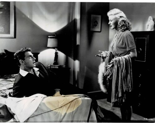 Image for A VINTAGE CONTINUITY LAYOUT PHOTOGRAPH depicting GINGER ROGERS speaking with JEAN-PIERRE AUMONT as he's reclining on his hotel bed in a scene from A VINTAGE CONTINUITY LAYOUT PHOTOGRAPH depicting GINGER ROGERS speaking with JEAN-PIERRE AUMONT as he's reclining on his hotel bed in a scene from