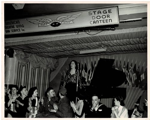 Image for ORIGINAL PHOTOGRAPH by ARTHUR C. MACAULAY of the Spanish Pianist AMPARO ITURBI accepting the applause of the audience at the American Theatre Wing War Service's ORIGINAL PHOTOGRAPH by ARTHUR C. MACAULAY of the Spanish Pianist AMPARO ITURBI accepting the applause of the audience at the American Theatre Wing War Service's