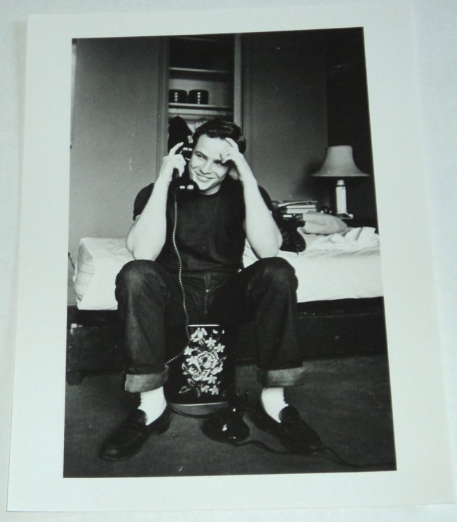 Image for A BEAUTIFUL ORIGINAL PHOTOGRAPH OF A VERY YOUNG MARLON BRANDO, SEATED AT THE TELEPHONE IN FRONT OF HIS UNMADE BED. A BEAUTIFUL ORIGINAL PHOTOGRAPH OF A VERY YOUNG MARLON BRANDO, SEATED AT THE TELEPHONE IN FRONT OF HIS UNMADE BED.