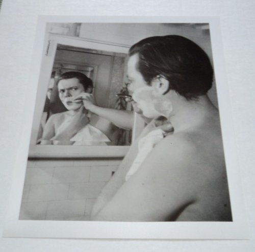 Image for A BEAUTIFUL ORIGINAL PHOTOGRAPH OF A YOUNG ORSON WELLES SHAVING IN FRONT OF A MIRROR. A BEAUTIFUL ORIGINAL PHOTOGRAPH OF A YOUNG ORSON WELLES SHAVING IN FRONT OF A MIRROR.