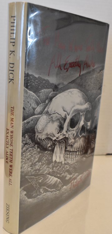 THE MAN WHOSE TEETH WERE EXACTLY ALIKE. The Rick DeMarco bookplate, issued from the publisher, is laid-in.
