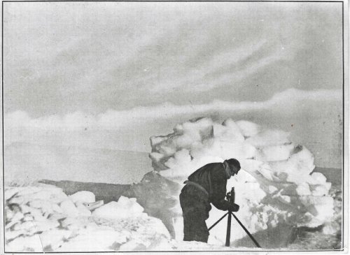 Photo of Frank Hurley lining up a shot, moments before falling through the ice