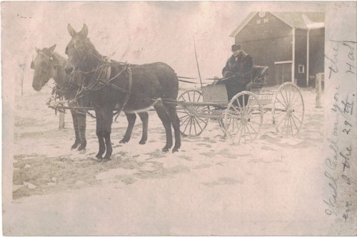 Postcard / RPPC - A winter scene of a horse & buggy, with a bundled-up man [1906]